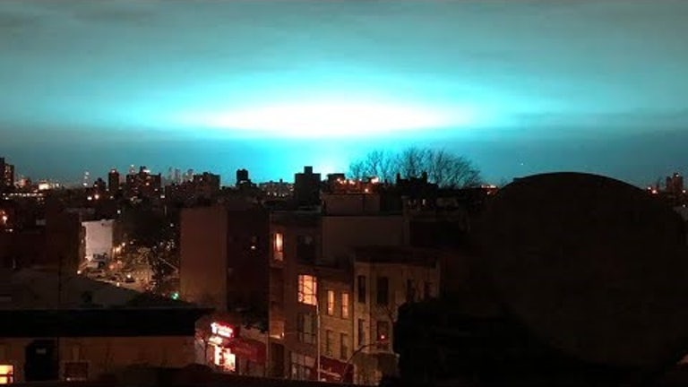 Blue Light Illuminates New York Sky